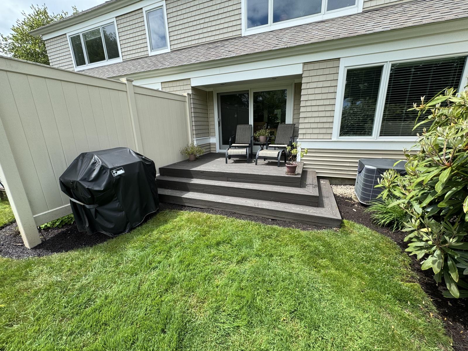 Before: Deck replacement — dated composite deck replaced with a custom-built deck with privacy walls