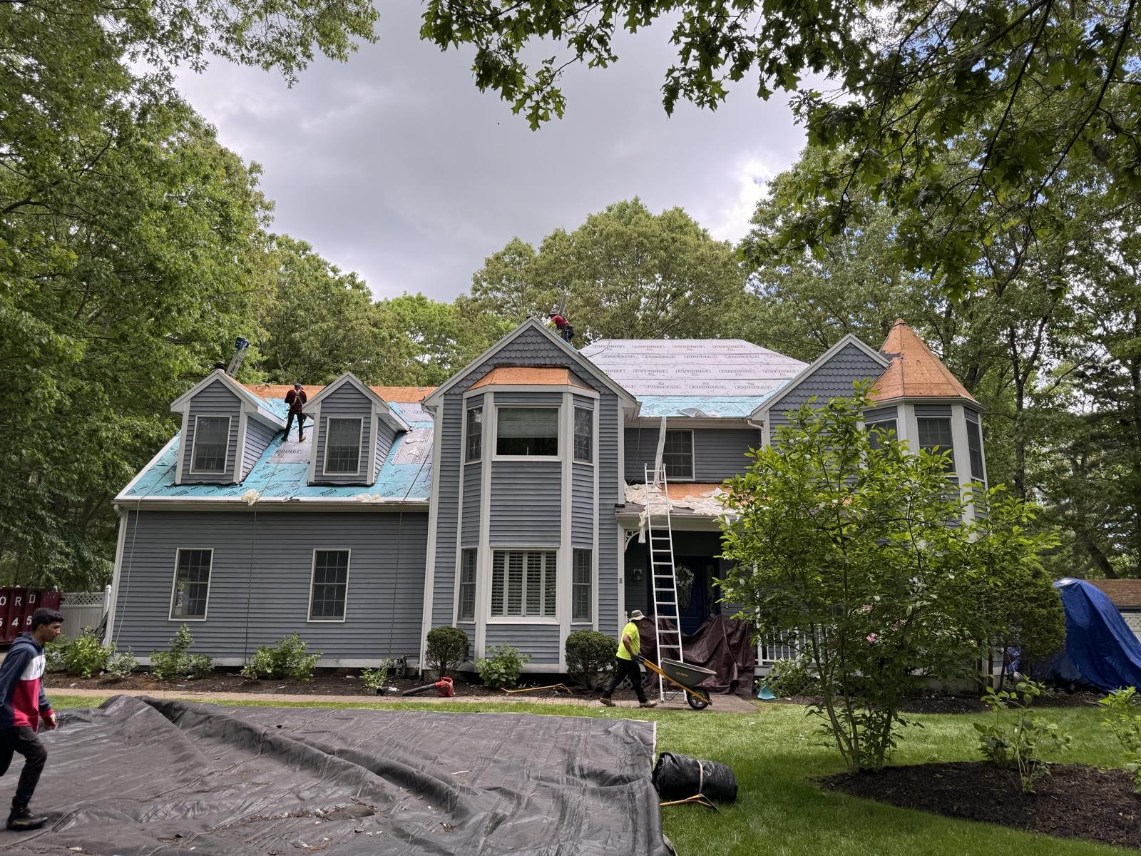 Before: Full roof replacement — tear-off with underlayment exposed replaced with a finished architectural shingle roof